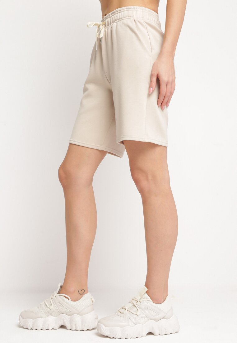Pantaloni scurți Bej deschis Cu elastic în talie și buzunare laterale Ritardia