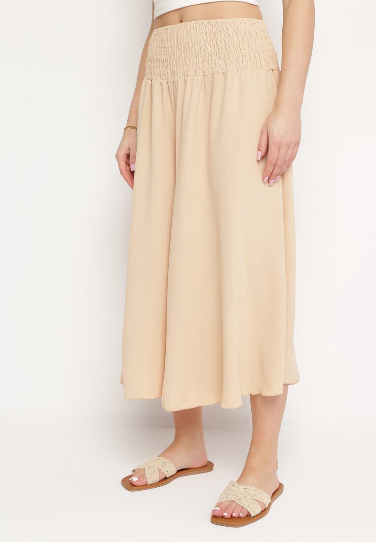 Pantaloni bej deschis largi trei sferturi cu elastic în talie Marinesta