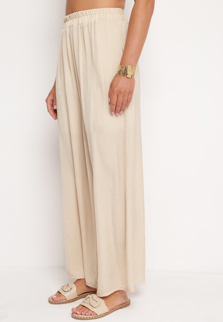Pantaloni bej largi din viscoză cu talie înaltă Rissalie